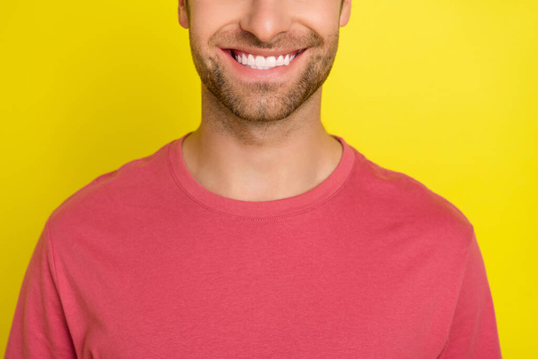 Cropped photo of cheerful candid guy toothy beaming smile wear pink t-shirt isolated yellow color background - Fotó, kép