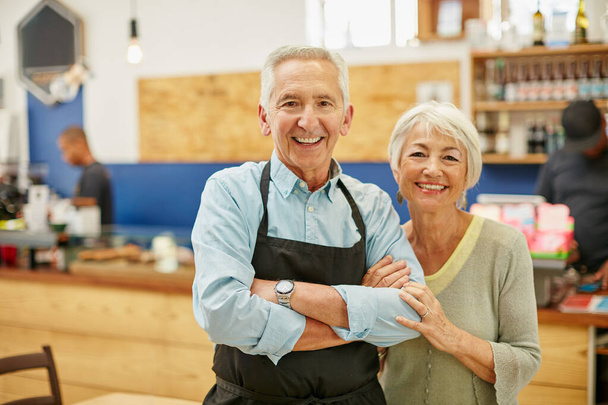 Proud to say were open for business. Shot of a senior couple running a small business together. - Photo, Image