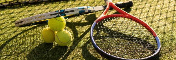 Close up view of two tennis rackets and balls on the tennis court. - Photo, Image