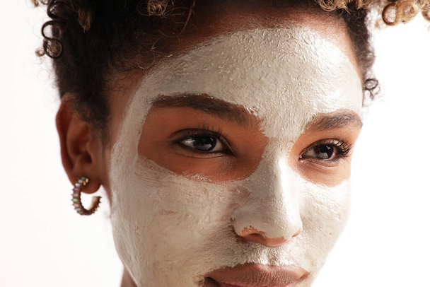 Close-up of beautiful woman with moisturising face mask, cares of skin beauty. - Фото, изображение