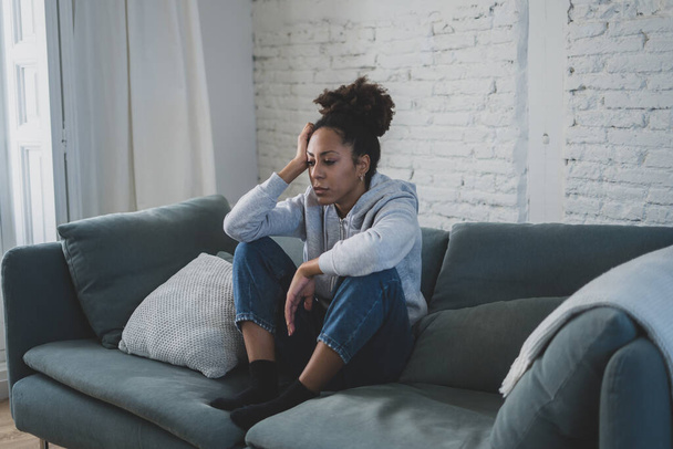 Young devastated depressed african american woman crying feeling sad, hurt suffering depression in sadness and emotional pain. Mental health in young people, bullying suicide and heartbroken concept. - Foto, afbeelding