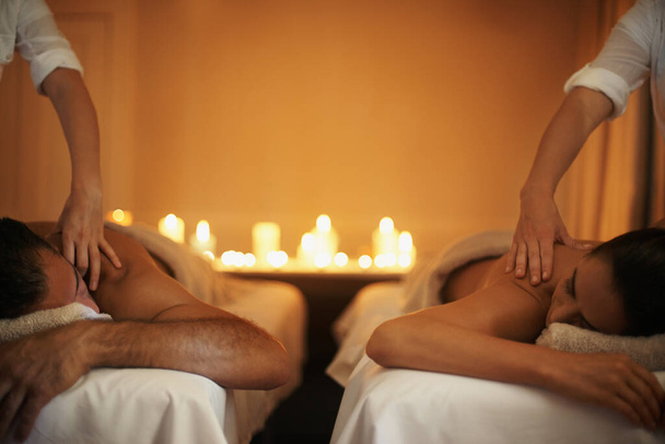 Enjoying a mutual massage. Shot of a mature couple enjoying a relaxing massage. - Photo, Image