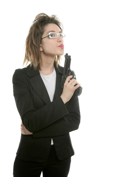 Businesswoman with messy hair and handgun - Foto, Imagen