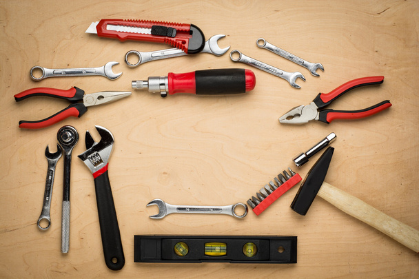 Set of tools on a wood panel - Foto, Bild