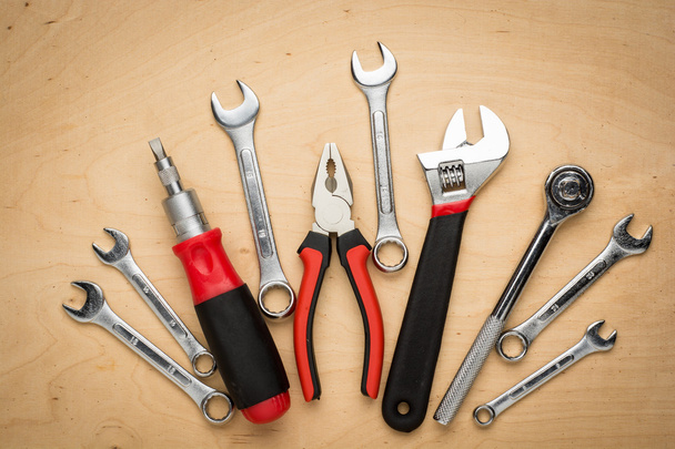 Set of hand tools on a wooden panel - Foto, Bild
