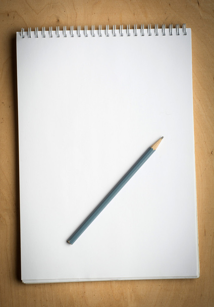 notebook with pencile on a wooden - 写真・画像