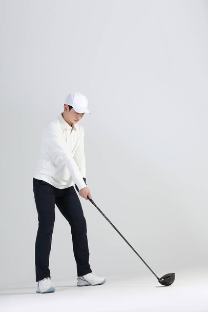 golf sports player, asian korean man with golf club in studio - Fotografie, Obrázek