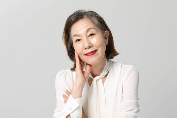 Asian Korean senior woman, bold and red cosmetics makeup beauty concept in studio - Φωτογραφία, εικόνα