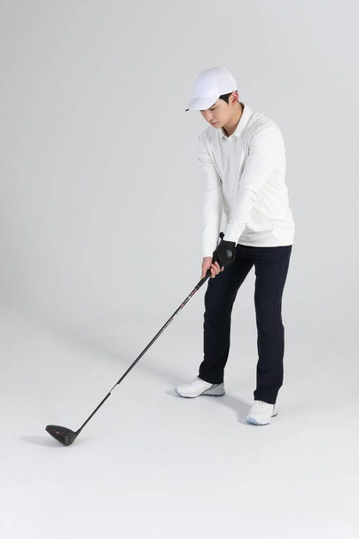 golf sports player, asian korean man with golf club in studio - Fotó, kép