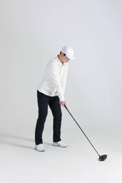 golf sports player, asian korean man with golf club in studio - Fotó, kép