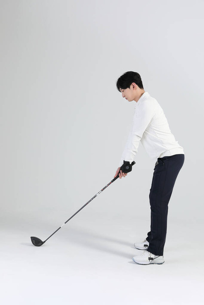 golf sports player, asian korean man with golf club in studio - Фото, изображение