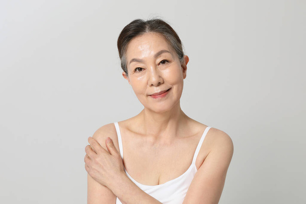 Asian Korean senior woman, basic skin care beauty concept in studio - Zdjęcie, obraz