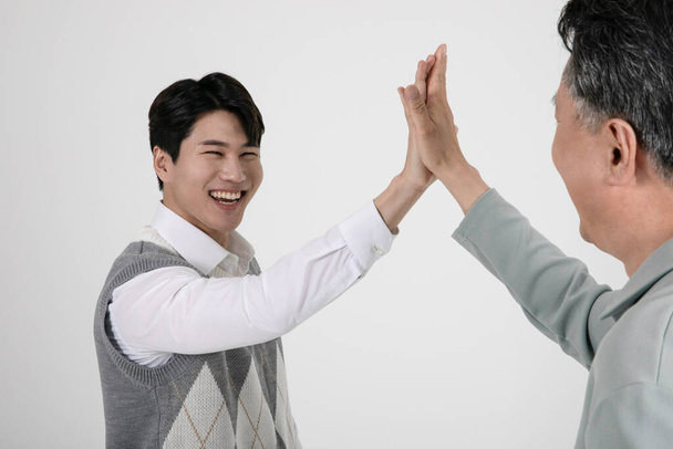 asian korean old and young two men making high five - Fotó, kép