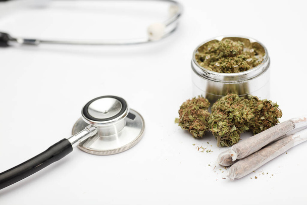 marijuana buds, joint, phonendoscope, with white background, - Foto, Imagen