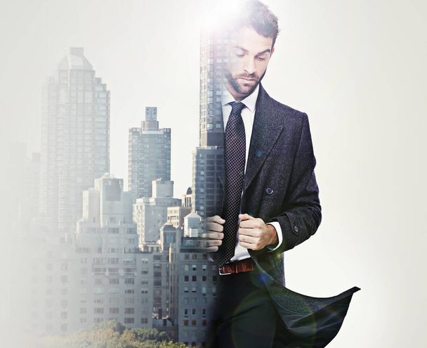 Man about town. Composite image of a handsome well-dressed man superimposed with the city. - Fotografie, Obrázek