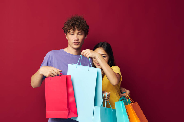 cute young couple colorful bags shopping fun Lifestyle unaltered - Fotografie, Obrázek