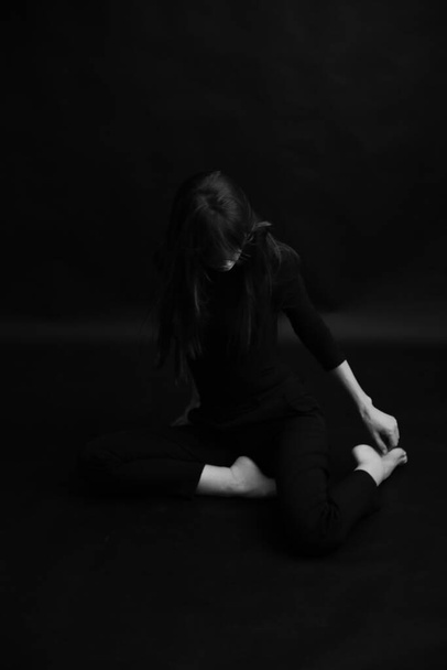 art photography, dancer expresses emotions through movement, body abstraction on black backgroun - Fotó, kép