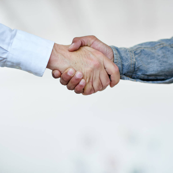 Youve got yourself a deal. Cropped shot of two businesspeople shaking hands. - Valokuva, kuva