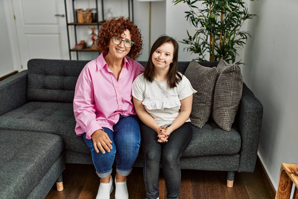 Mature mother and down syndrome daughter at home - Photo, Image