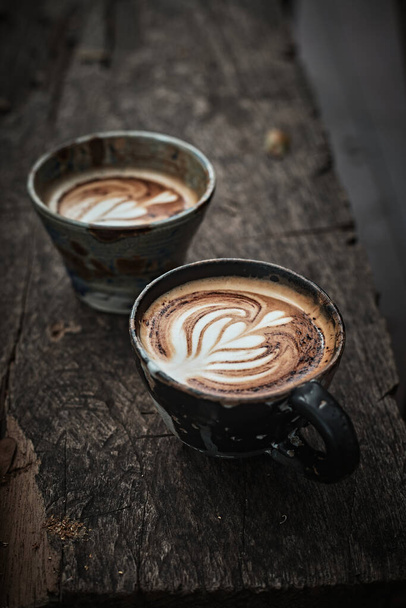 Selective focus cup of hot latte art coffee,focus at white foam - Fotoğraf, Görsel