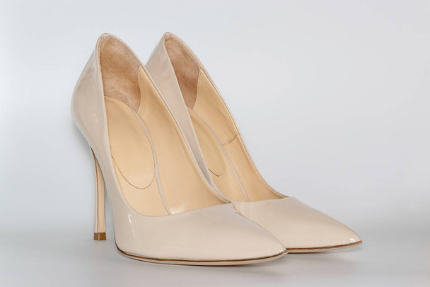 Front view of the nude colored high heeled womens shoes. - Photo, Image