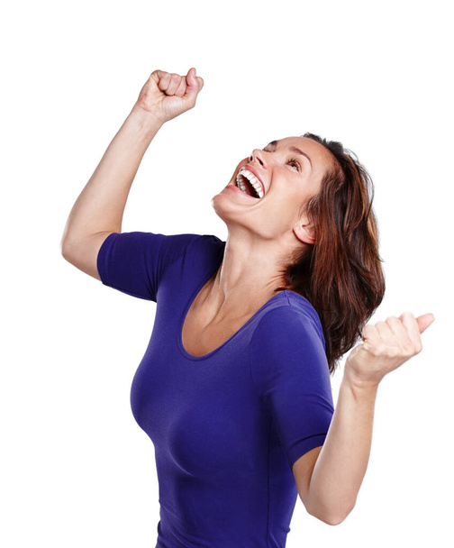 A vitória é minha. Uma jovem mulher em uso casual perfurando o ar em celebração. - Foto, Imagem