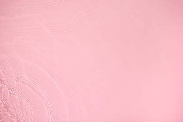 transparent pink colored clear calm water surface texture  - Foto, Bild