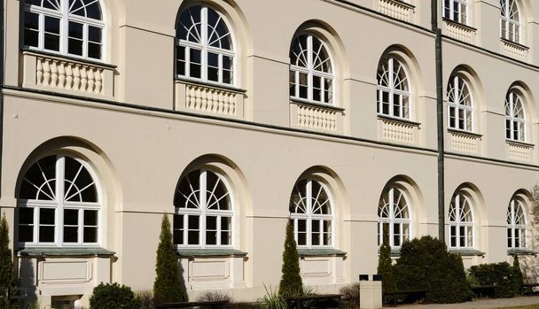 Courtyard of John Paul II Catholic University of Lublin old facade with rows of windows - Foto, imagen
