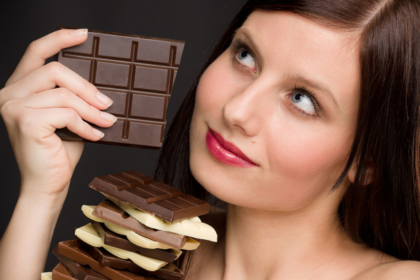 Chocolate - portrait healthy woman enjoy sweets - 写真・画像