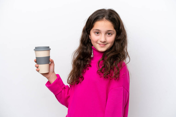 Little caucasian girl holding a take away coffee isolated on white background smiling a lot - Foto, Bild
