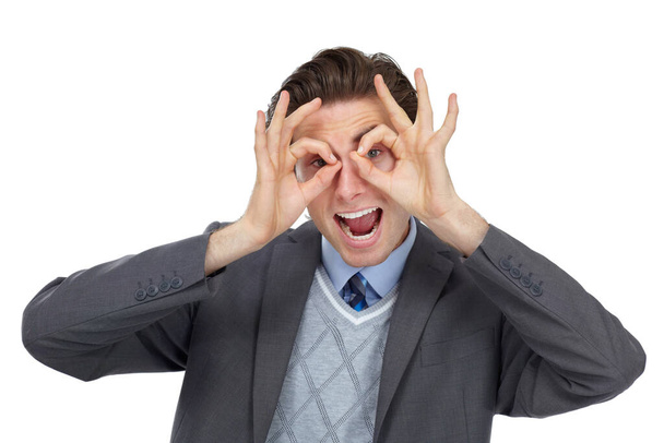 I see you. Playful image of an excited businessman pretending his hands are glasses - isolated. - Foto, Imagen