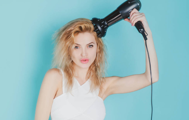 Woman blow drying her hair. Young girl with drying hair with hair dry. Health hair and beauty concept. - Φωτογραφία, εικόνα