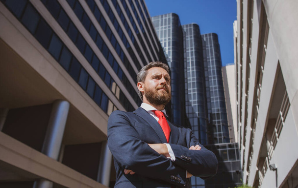 Entrepreneur, business portrait. Businessman standing proud with arms crossed outside. - Photo, image
