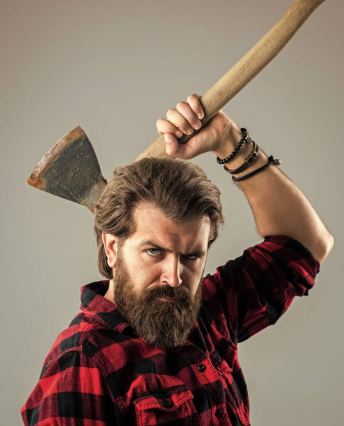 bearded male hipster in checkered shirt hold ax, camping - Foto, imagen