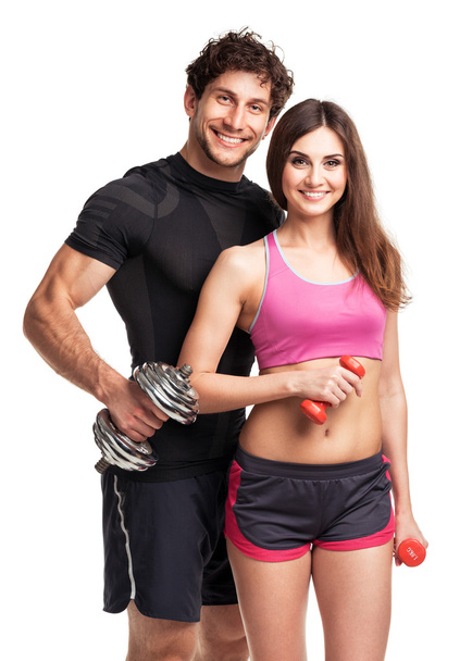 sportos pár - férfi és nő a súlyzó, a fehér - Fotó, kép
