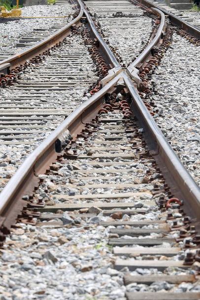 Geometric composition with train tracks in perspective towards horizon - Photo, Image