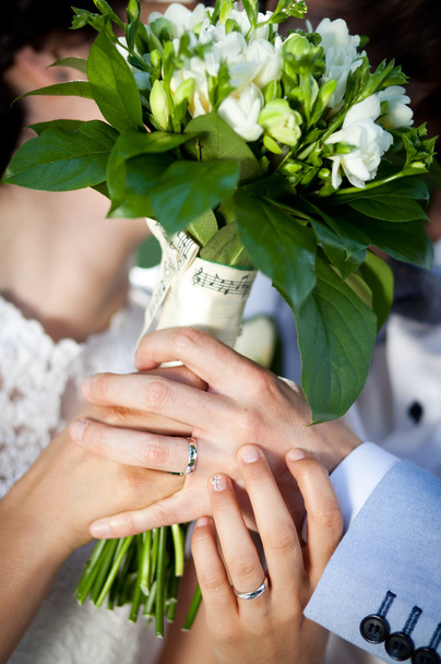 Newly wed couple holding bouquet - Photo, Image
