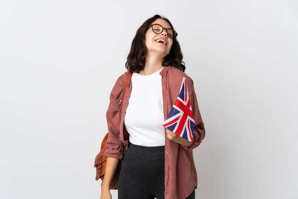Tiener Oekraïense meisje met een vlag van het Verenigd Koninkrijk lachen - Foto, afbeelding