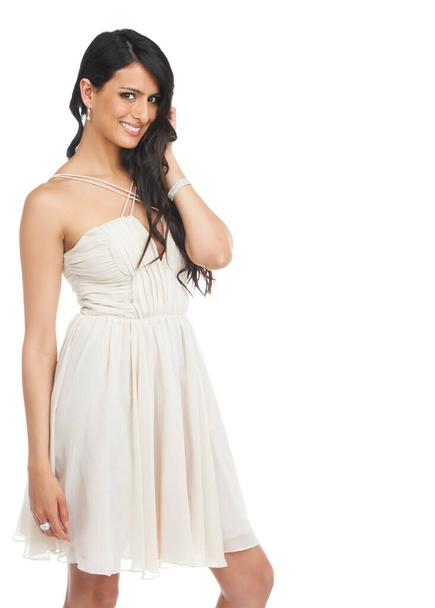 Elke jongen droomt meisje. Studio shot van een aantrekkelijke jonge vrouw in een cocktail jurk poseren tegen een witte achtergrond. - Foto, afbeelding