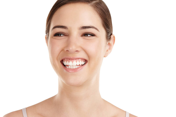 Beautiful smile. Cropped shot of a beautiful young woman isolated on white. - Photo, Image