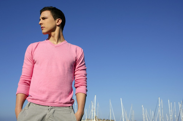 Handsome young man on summer in harbor - Фото, изображение