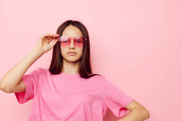 young beautiful woman in stylish glasses posing emotions isolated background - 写真・画像