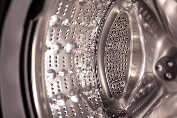 Çamaşır makinesi fıçısı kuru ve yakın çekim. Çamaşır Kurutma Makinesi bir davul görünümünde. - Fotoğraf, Görsel