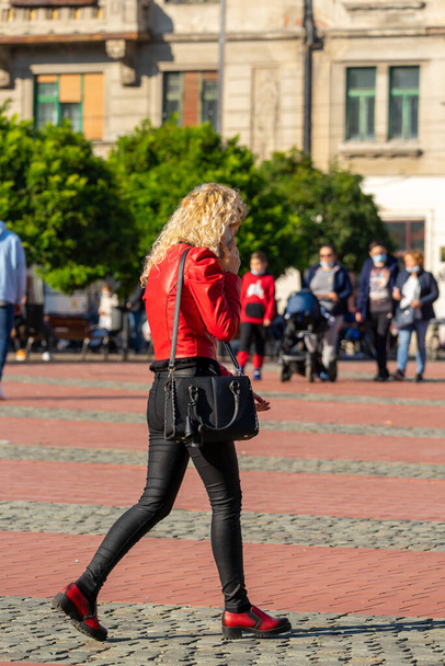 Woman walking on the street. Real people. - Fotó, kép