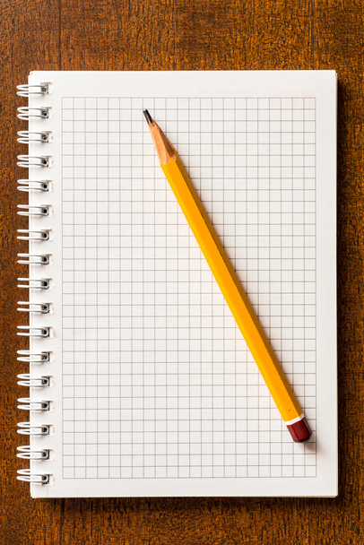 The pencil and notebook - Фото, изображение