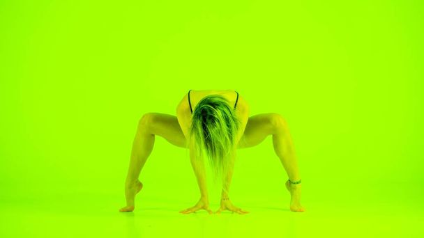 Blonde woman doing yoga exercise in studio close up Artistic photo - Fotoğraf, Görsel