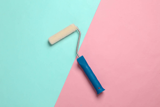 Paint Roller on pink blue background - Photo, Image
