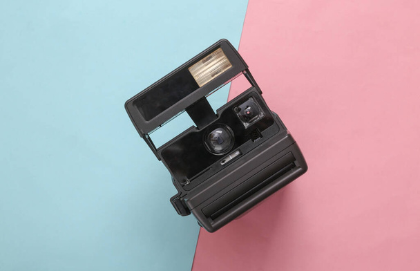 Retro 80s photo camera on blue pink pastel background. Top view. Flat lay - Foto, immagini