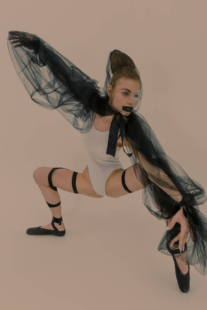 Fashion ballerina with art makeup and hair poses in the studio  - Valokuva, kuva
