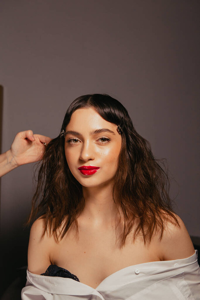 Portraits of a beautiful girl with makeup and red lips - Foto, Imagem